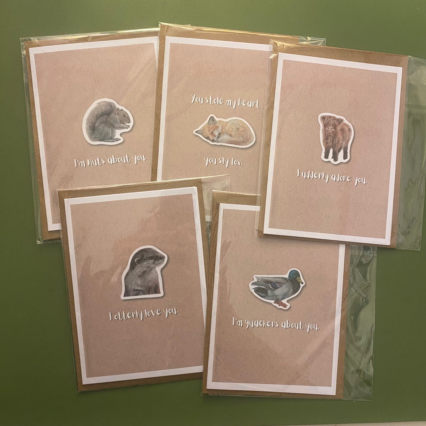 cute pun ainimal greetings cards with otter, fox, highland cow calf, squirrel and duck for Valentine's day