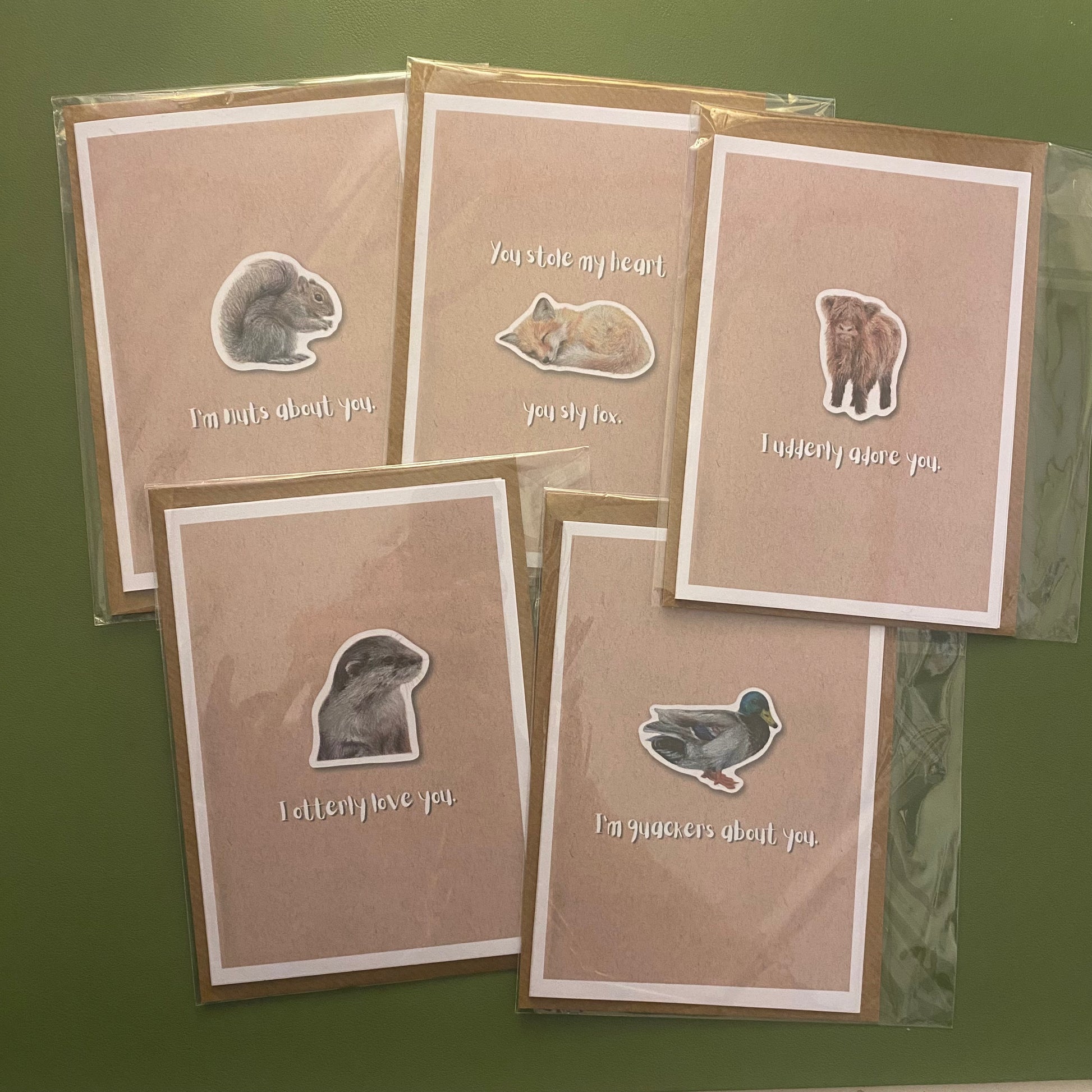 cute pun ainimal greetings cards with otter, fox, highland cow calf, squirrel and duck for Valentine's day